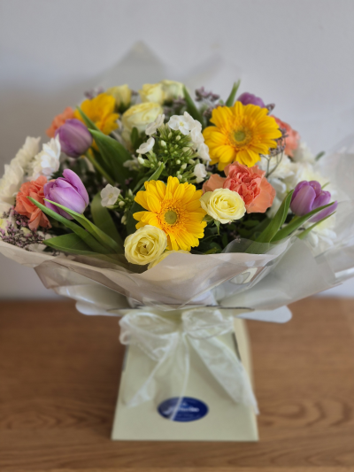 Spring bright - A beautiful selection of fresh flowers in bright shades of spring and summer blooms. 
Freshly selected each day by the florist