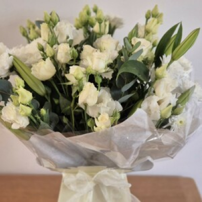Thinking of you - A beautiful fresh selection of flowers in shades of white and green. This arrangement is in water ready to enjoy.