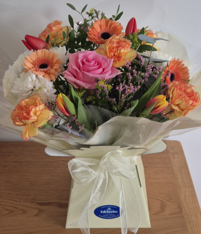 Sunshine Mum - A colourful arrangement of beautiful fresh mixed flowers including a pretty pink heart. Perfect to put a smile on her face.